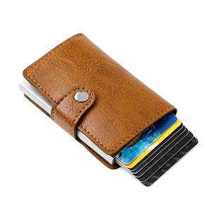 Brown leather RFID blocking wallet with aluminum pop-up card holder and snap button closure