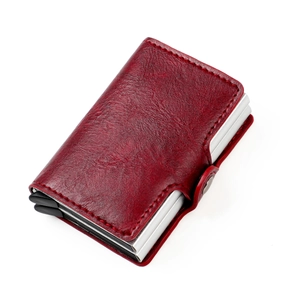 Detail of red leather RFID wallet with silver metal card holder and snap button closure