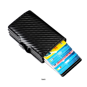 Detail of black carbon fiber RFID wallet with automatic slide ejector mechanism