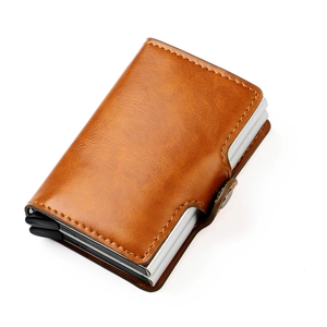 Close-up of brown leather RFID blocking wallet with aluminum card case and metal clasp