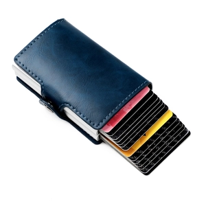 Detail of blue leather RFID wallet showing silver aluminum card slot pop-up mechanism