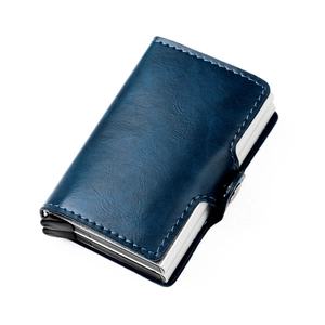 Detail view of a navy leather pop-up wallet with silver metal RFID blocking slot