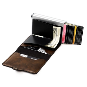 Macro detail of brown leather RFID wallet with mechanical pop-up silver aluminum card holder