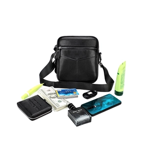 Detail showing high-capacity interior of men's leather crossbody chest bag with pockets