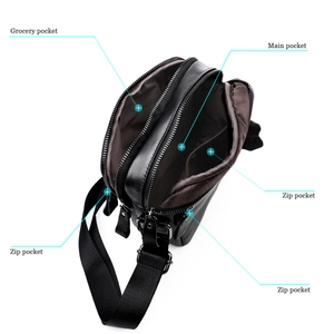 Top view of men's leather crossbody bag showing main pocket and triple zip compartments