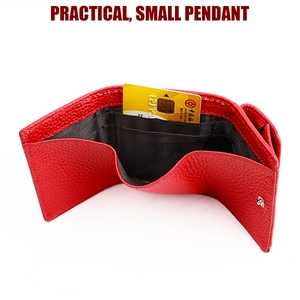 Macro view of red pebbled leather tri-fold wallet with card slots and RFID protection