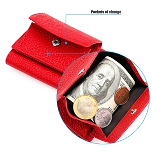 Detail view of red lychee grain leather wallet showing internal change pocket and silver button