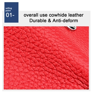 Macro shot of durable red cowhide leather with a visible lychee grain texture