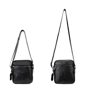 Men's black leather crossbody chest bag with adjustable shoulder strap and textured finish
