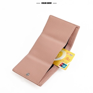 Detail view of pink genuine leather wallet showing litchi texture and card slot capacity