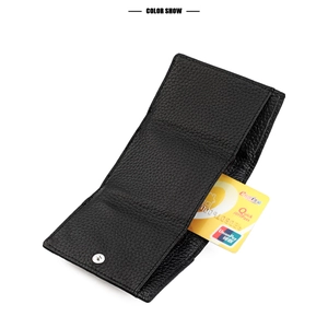 Detail of black pebbled leather wallet showing silver snap closure and card slots
