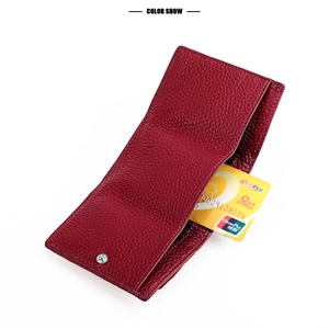 Detail of burgundy lychee grain leather wallet showing multiple functional card slots