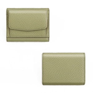 Macro detail of pebble grain leather texture on a green trifold short wallet