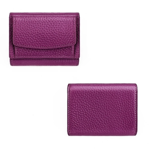 Close-up of premium purple pebble grain leather texture on short bi-fold women's wallet