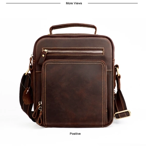 Detailed front view of dark brown crazy horse leather messenger bag with vintage hardware
