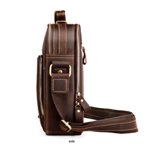 Side view of vintage crazy horse leather messenger bag with multi-layer zippers and stitching