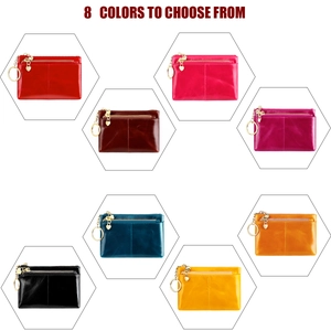 Collection of eight oil wax leather coin purses with heart pendants and zipper closure