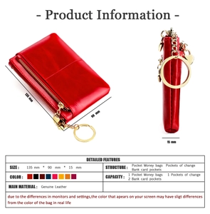 Detail view of red genuine leather coin purse with golden heart pendant and key ring