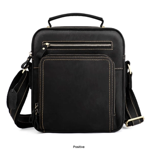 Close-up of black crazy horse leather messenger bag with top handle and zipper pocket
