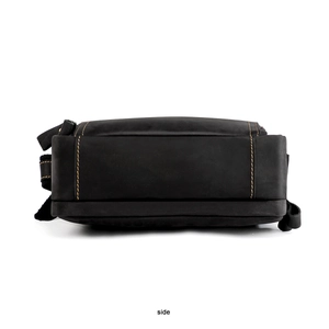 Side view of vintage crazy horse leather messenger bag with yellow contrast stitching