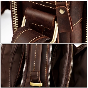 Detail of vintage brown crazy horse leather messenger bag with brass D-rings and stitching