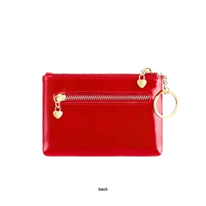 Detail of red oil wax leather coin purse back view with golden heart zipper and key ring
