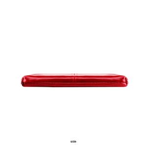 Side view detail of a sleek red oil wax leather coin purse with precise stitching