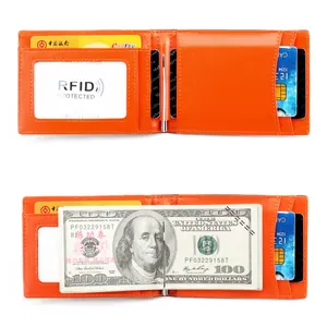 Detail view of orange slim wallet showing RFID card slot and metal money clip