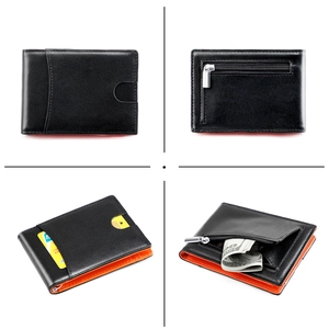 Detail of slim bifold wallet showing black leather exterior and orange contrast interior