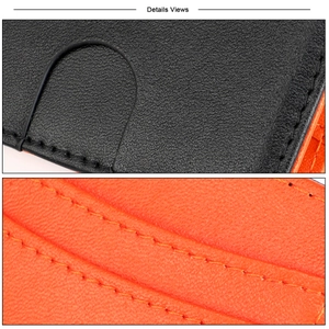 Macro detail of high-quality leather texture and precise orange stitching on a slim wallet
