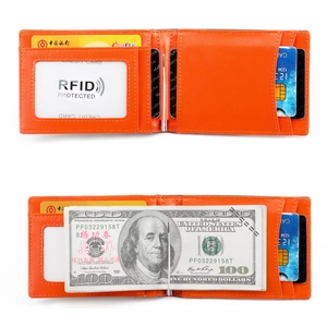 Detail of slim orange RFID blocking wallet showing metal money clip and card slots