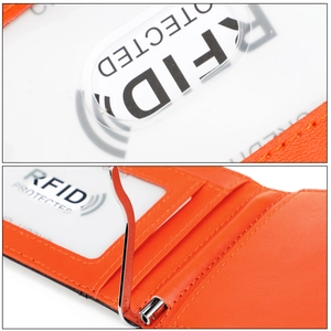 Detail of slim orange leather wallet featuring RFID protection and silver money clip