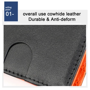 Close-up of black cowhide leather slim wallet with orange lining and durable stitching