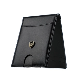 Detail of slim leather wallet with gold shield emblem and U-shaped card slot access