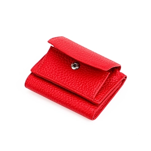 Red pebbled leather trifold wallet with snap button closure shown on white background