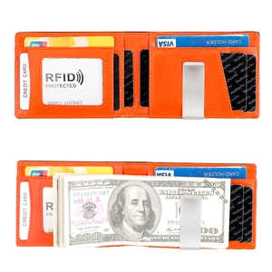 Detail of orange leather bifold wallet featuring RFID protection and a metal money clip