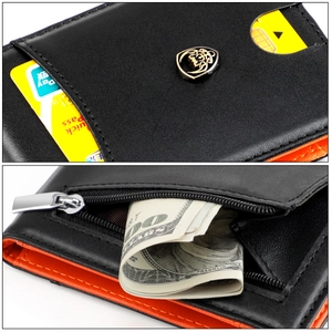 Detail of slim men's wallet showing black pebbled leather and orange contrast stitching