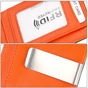 Detail of orange pebble leather wallet with RFID blocking slots and metal money clip