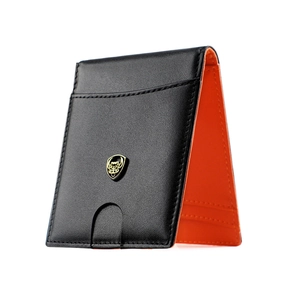 Slim bifold wallet with black pebble leather and vibrant orange lining with shield logo