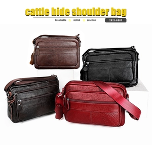 Detail of leather shoulder bags in four colors with multi-layered zipper compartments