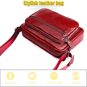Detailed view of red pebble leather shoulder bag features multiple zipper compartments