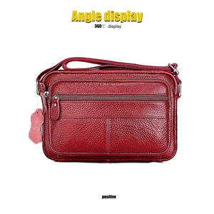 Front view of red genuine leather shoulder bag featuring multiple zipper pockets and lychee grain