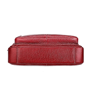 Detail of dark red lychee grain leather bottom with reinforced stitching and craftsmanship