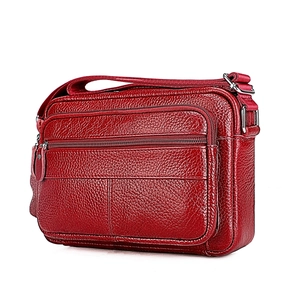 Dark red top grain leather shoulder bag with multiple zippered pockets for middle-aged women
