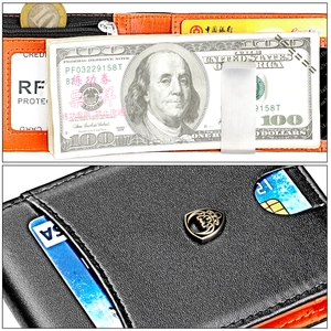 Détail du portefeuille en cuir avec protection RFID, intérieur orange et pince à billets