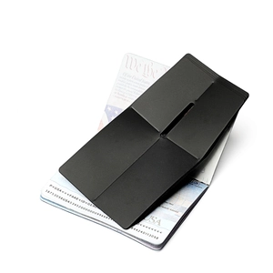 Slim black RFID passport holder with matte finish and seamless minimalist card slot design