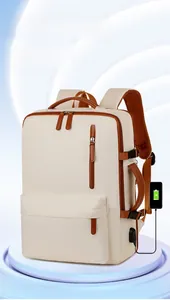 Detail showing the external USB charging port and ergonomic mesh straps on the backpack