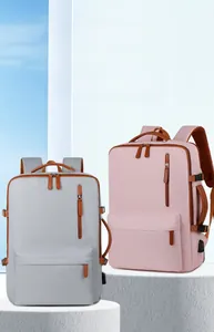 Detail view of Oxford cloth backpack with USB port and leather zipper pulls