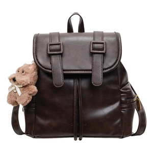 Retro dark brown PU leather backpack with buckle straps and a cute plush bear keychain