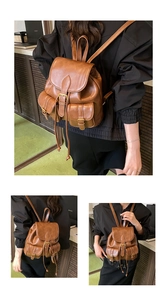 Detail view of brown leather backpack featuring vintage buckle pockets and adjustable straps